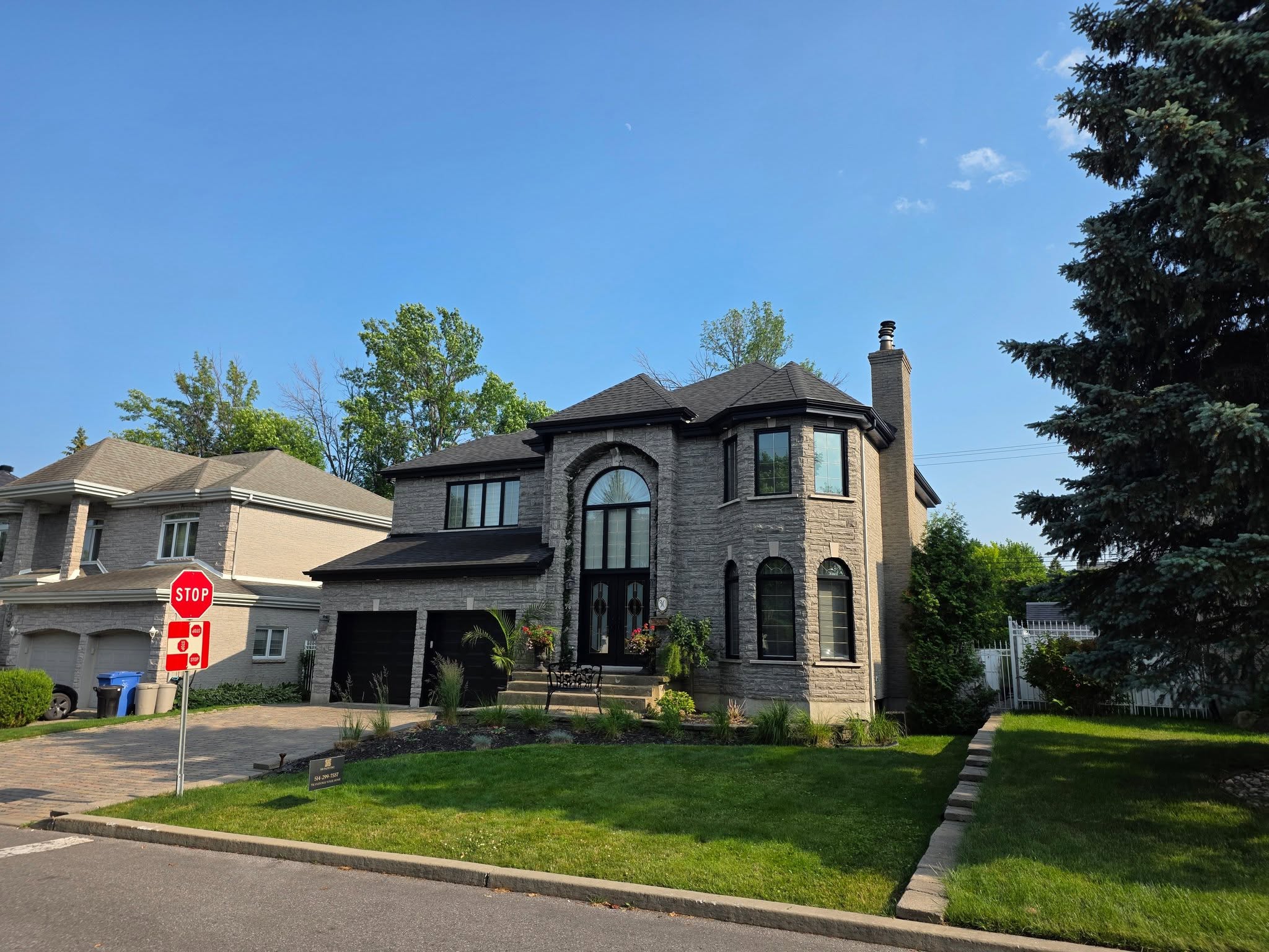 Completed residential exterior with coordinated dark details